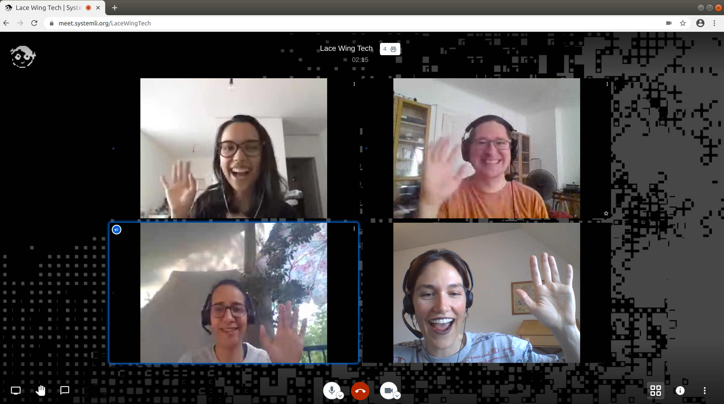 Four people wave and smile in a video call.